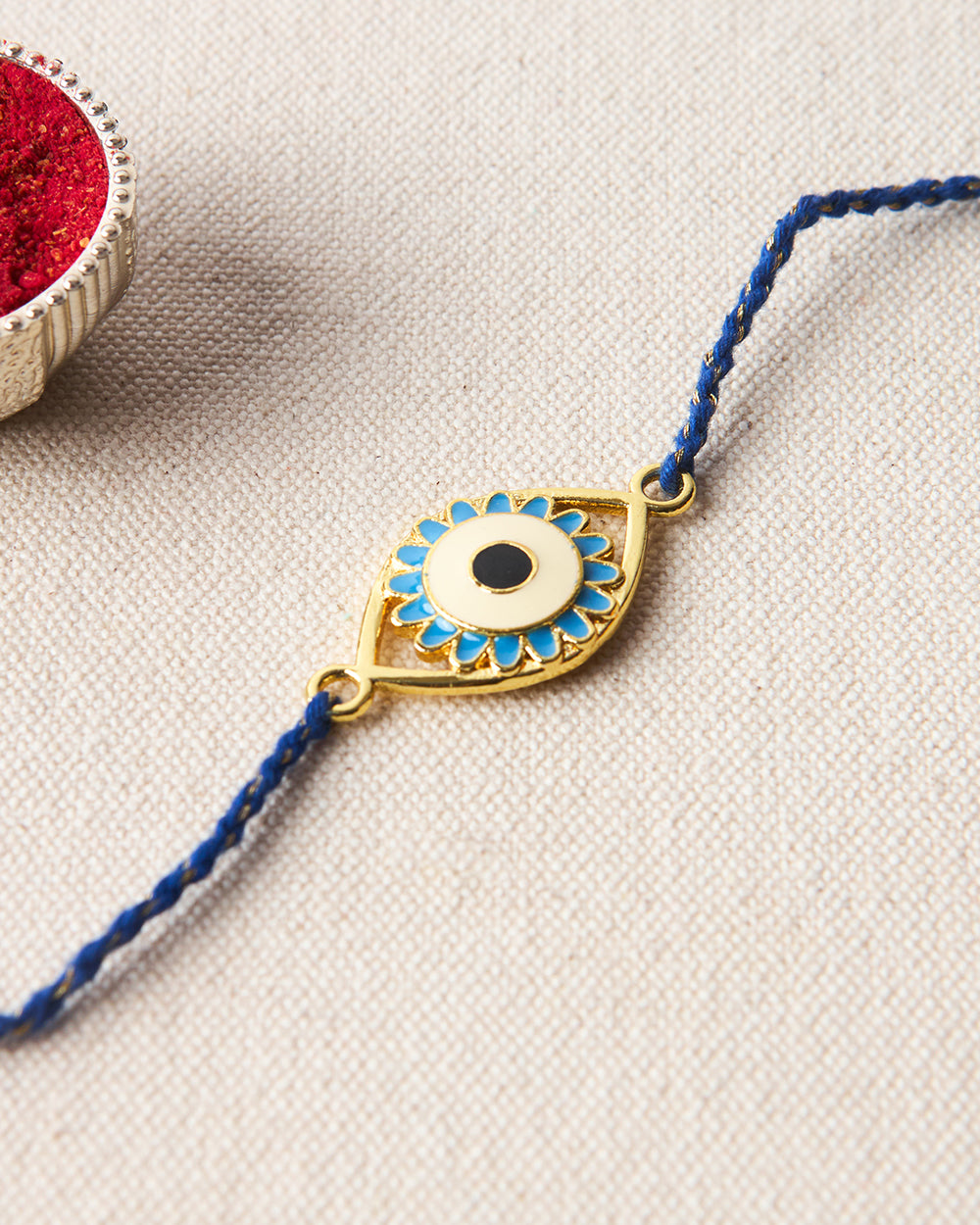 Evil-Eye Blue Rakhi - Brass Motif