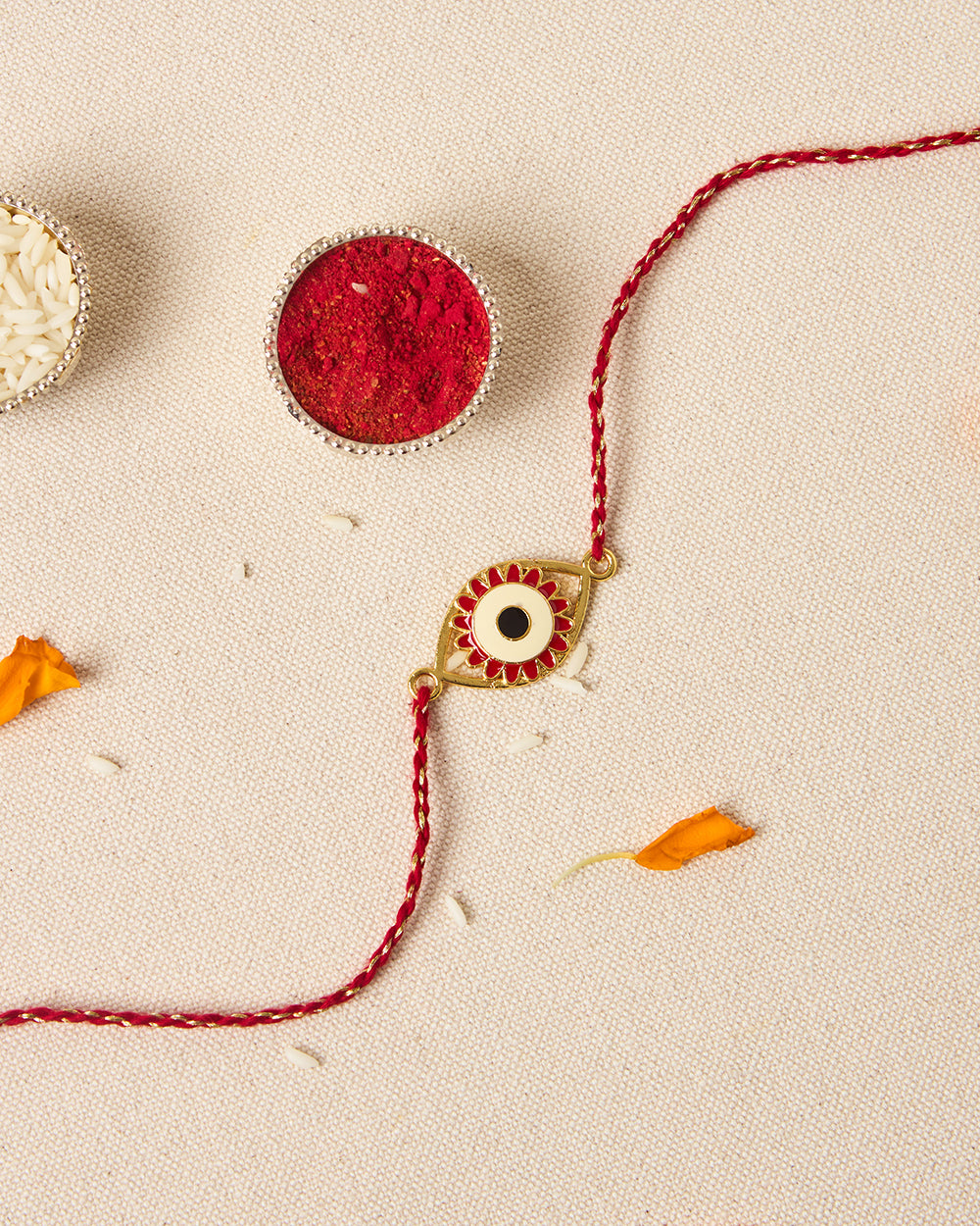 Evil-Eye Red Rakhi - Brass Motif
