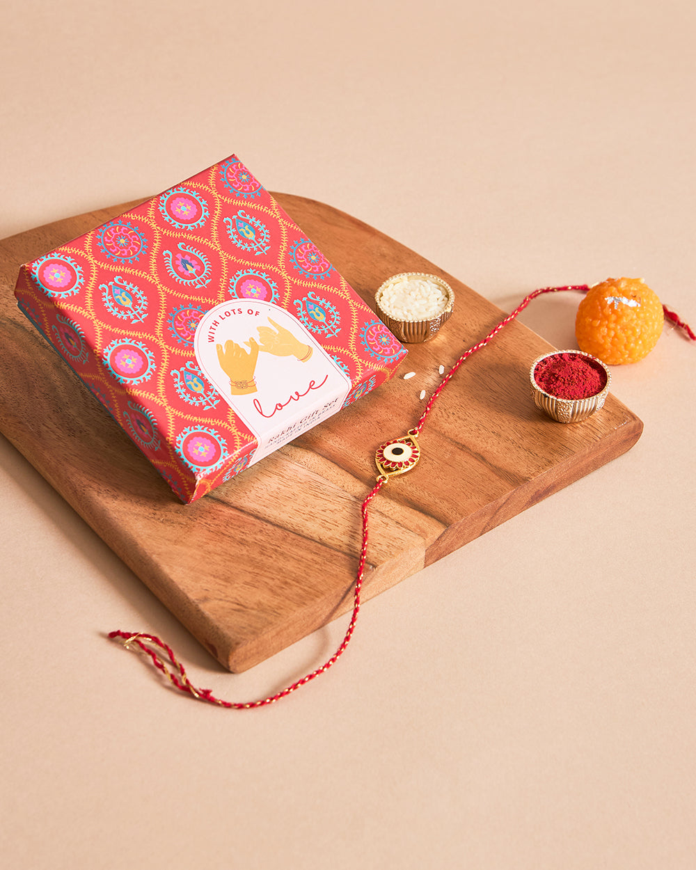Evil-Eye Red Rakhi - Brass Motif