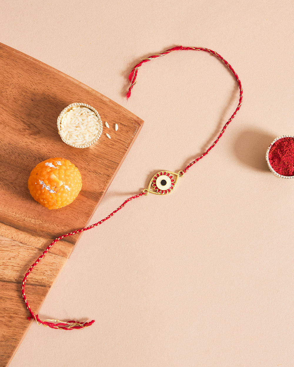 Evil-Eye Red Rakhi - Brass Motif
